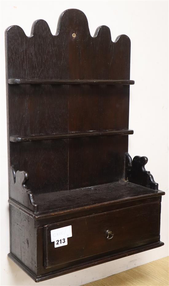 An 18th century oak spoon rack 59cm high